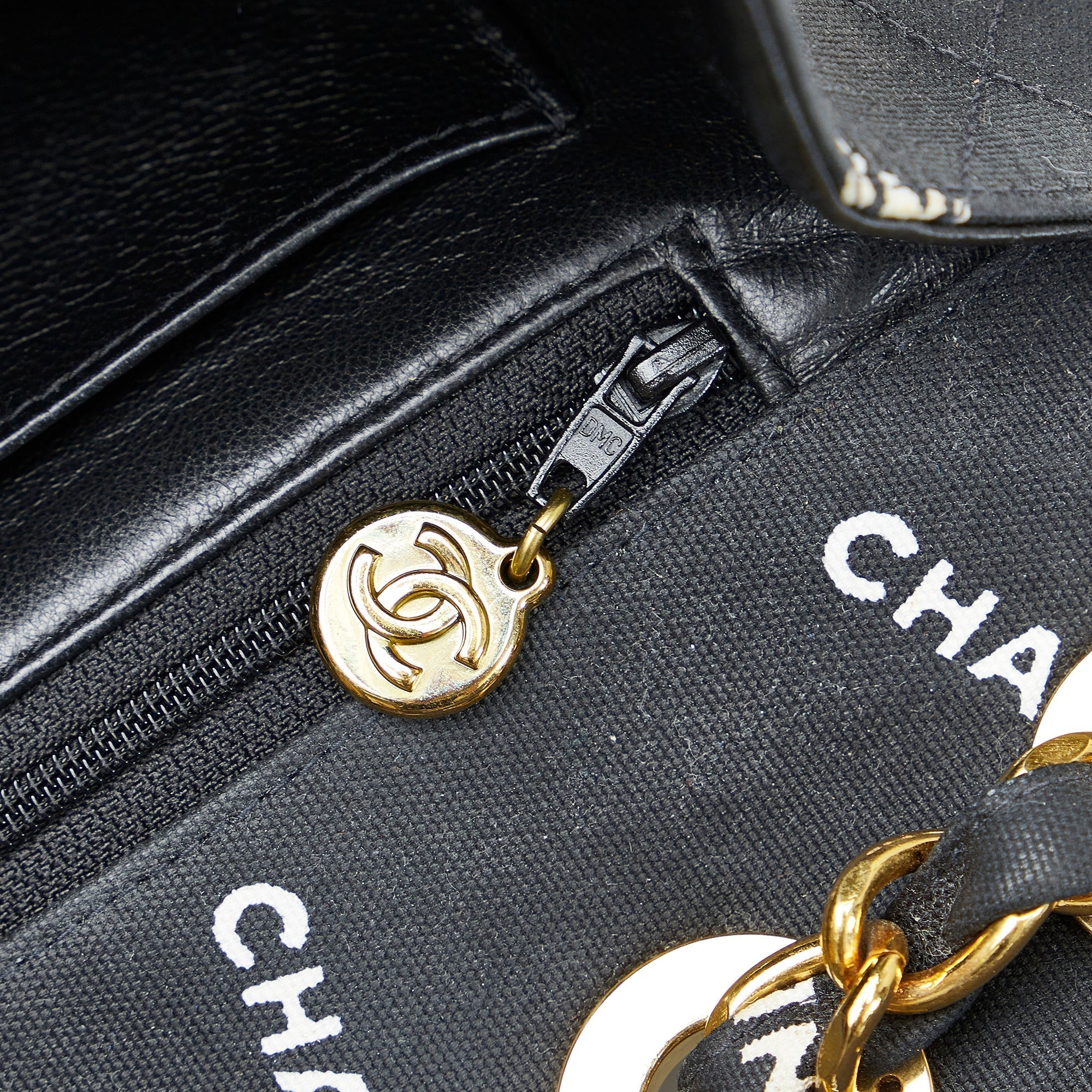 CHANEL Maxi Logo Printed CC Matelasse Flap Bag