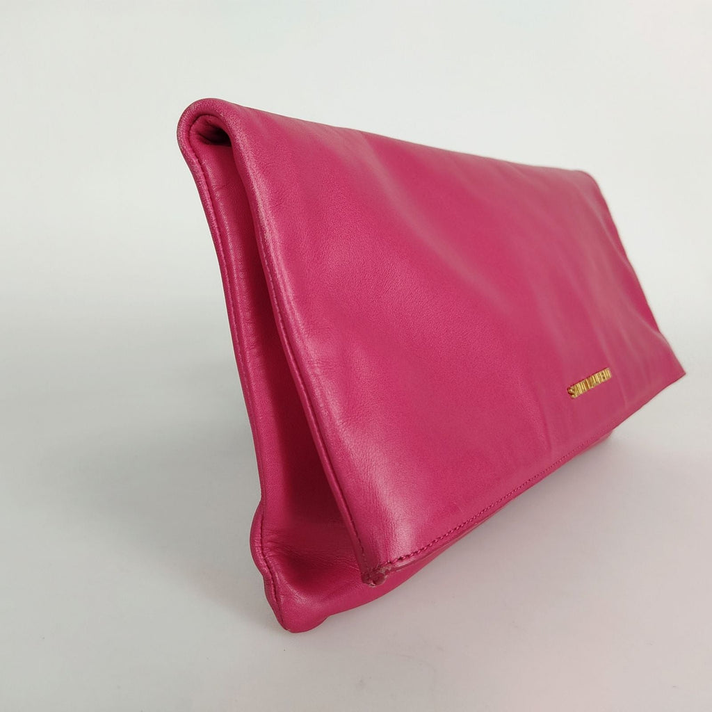 SAINT LAURENT maxi clutch bag in fuchsia leather