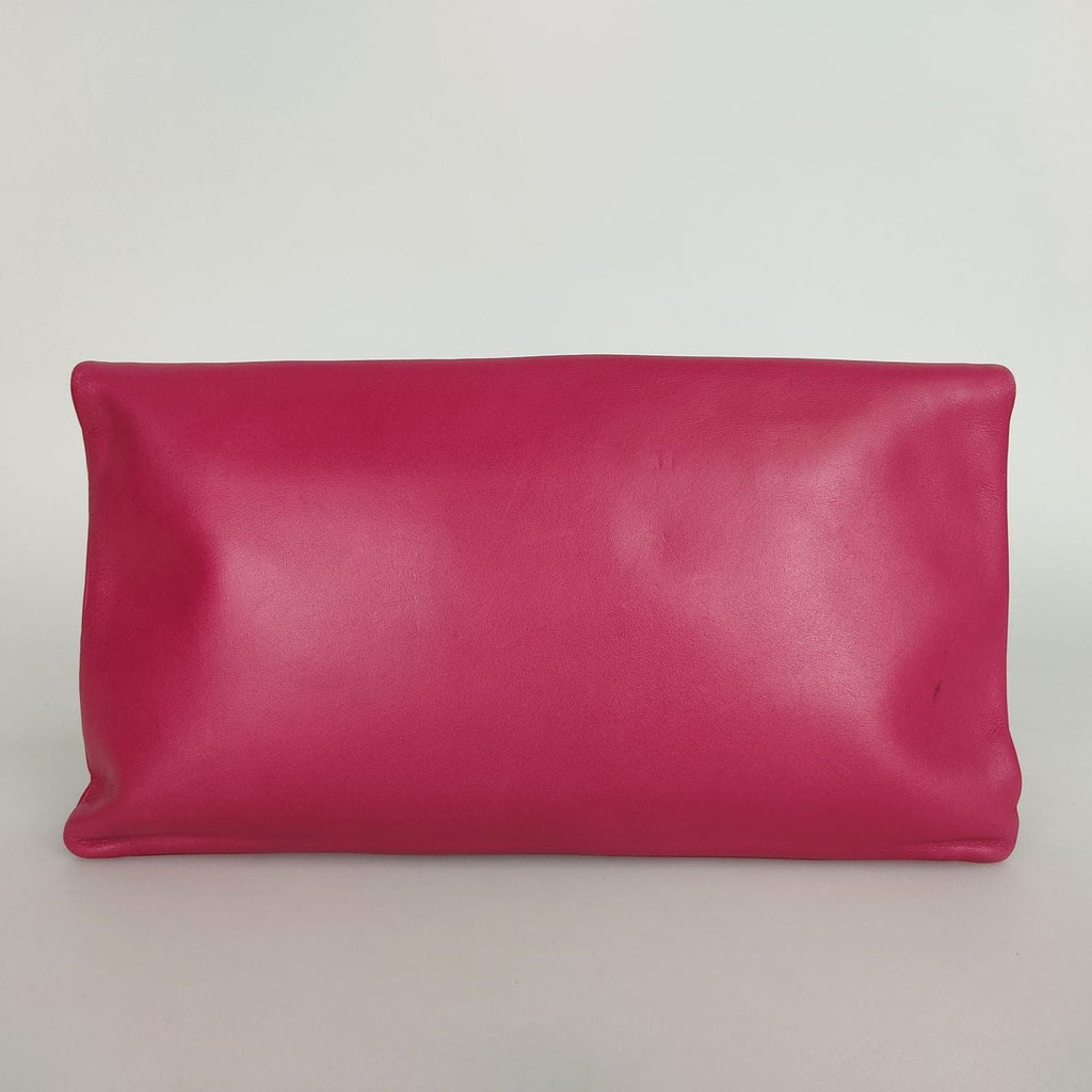 SAINT LAURENT maxi clutch bag in fuchsia leather