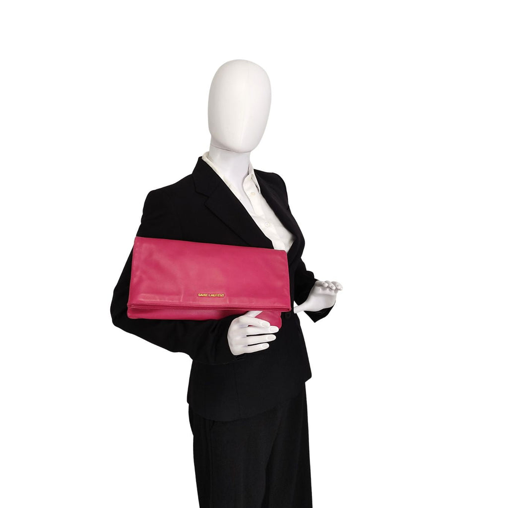 SAINT LAURENT maxi clutch bag in fuchsia leather