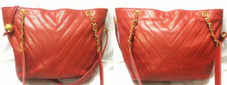 CHANEL Vintage red caviarskin v stitch, chevron style chain shoulder tote bag with golden CC ball charm