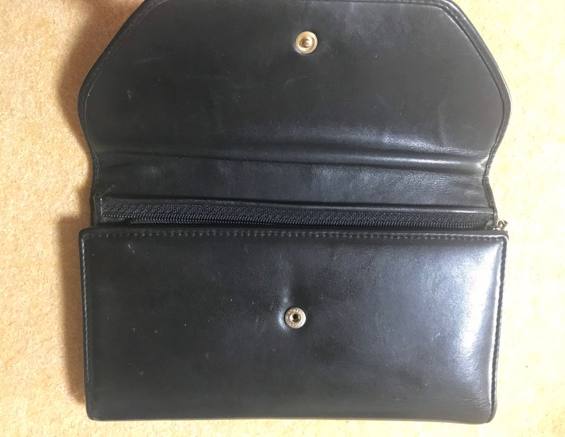 CHANEL Vintage black leather wallet with large CC stitch mark