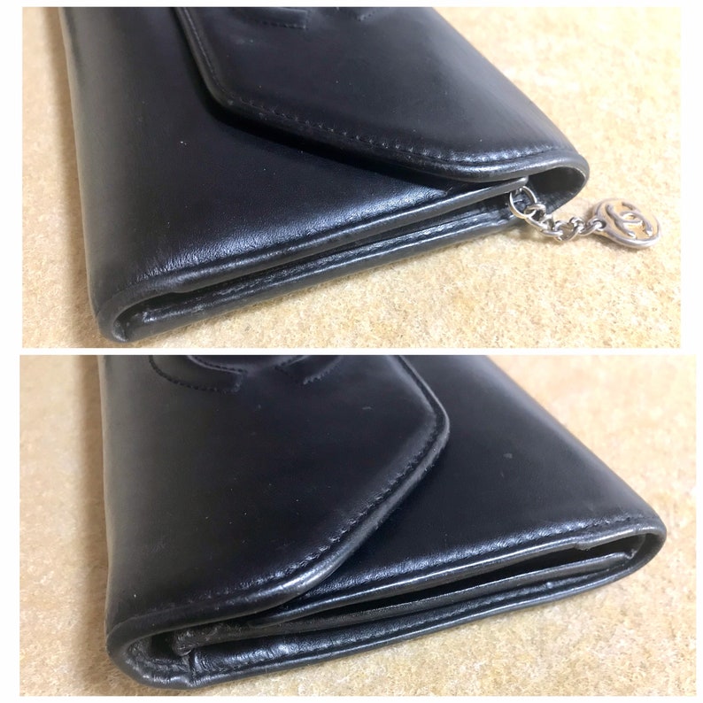 CHANEL Vintage black leather wallet with large CC stitch mark