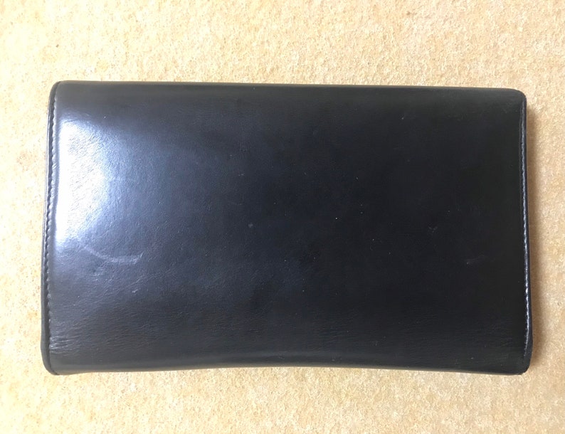 CHANEL Vintage black leather wallet with large CC stitch mark