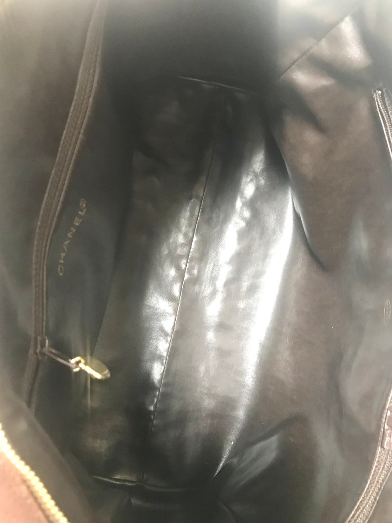 CHANEL Vintage brown caviarskin v stitch, chevron style bag, Speedy bag with golden CC charm